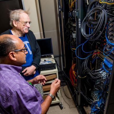 Dr. Bhattacharyay and Dr. King working on the supercomputer.